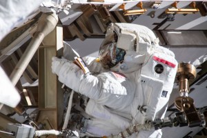 NASA spacewalker Anne McClain works on the International Space Station's Port-4 truss structure during a six-hour, 39-minute spacewalk to upgrade the orbital complex's power storage capacity.