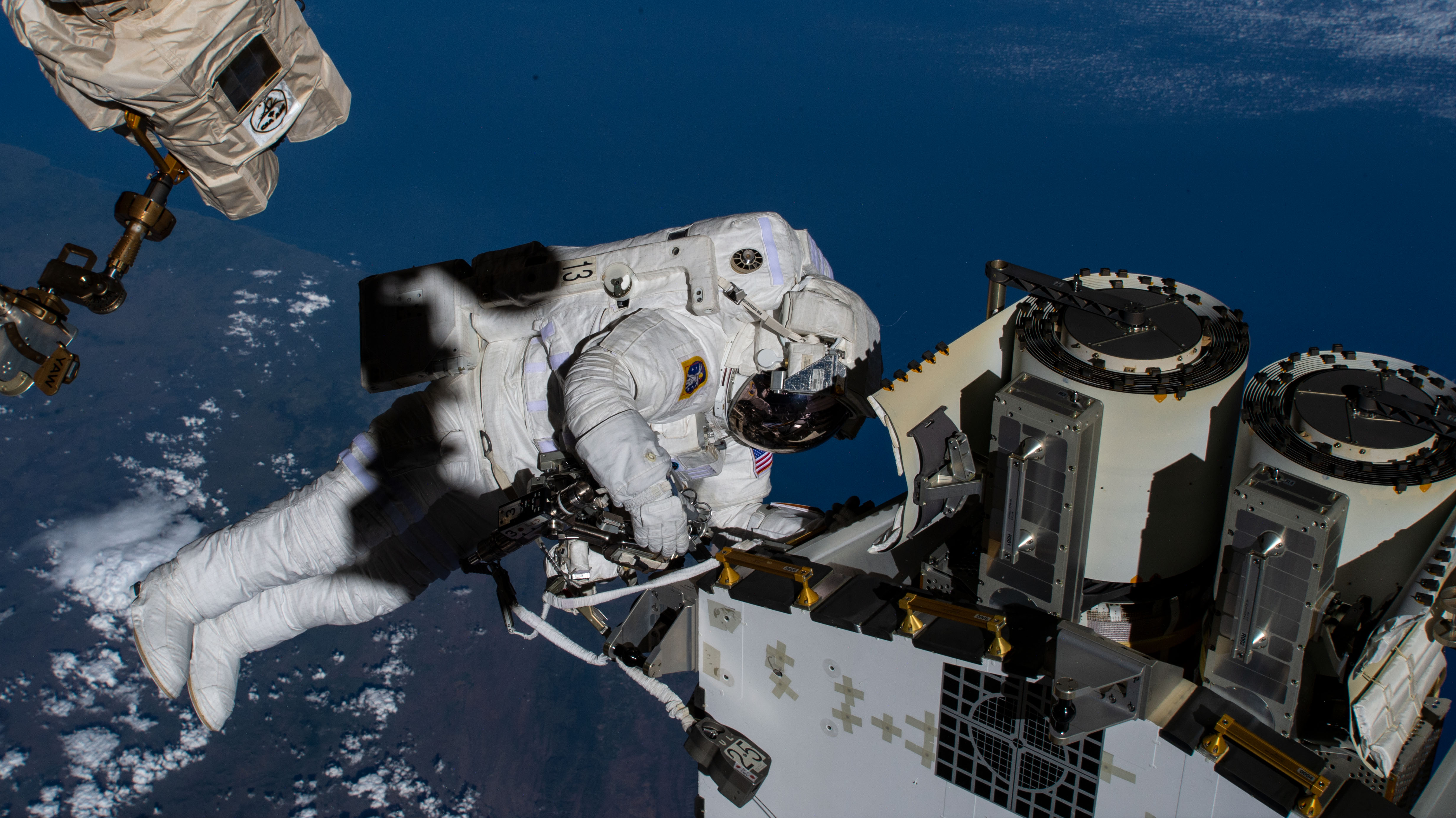 iss068e031767 (Dec. 22, 2022) --- Expedition 68 Flight Engineer and NASA spacewalker Josh Cassada prepares a roll-out solar array for its deployment on the International Space Station's Port-4 truss segment as the orbiting lab flew 264 miles above the Indian Ocean off the coast of South Africa.
