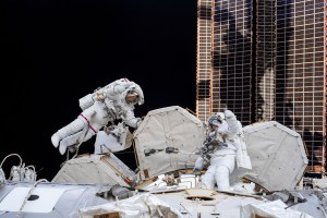 NASA spacewalkers (from left) Bob Behnken and Chris Cassidy give a thumbs up during a spacewalk to install hardware and upgrade International Space Station systems. This photograph was taken by an Expedition 63 crew member inside the cupola, the orbiting lab's "window to the world."