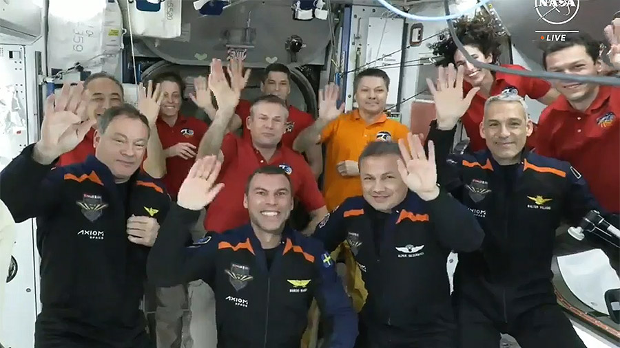 The four Axiom Mission 3 astronauts, front row, and the seven Expedition 70 crew members wave to the camera following a crew greeting ceremony on the International Space Station on Jan. 20.