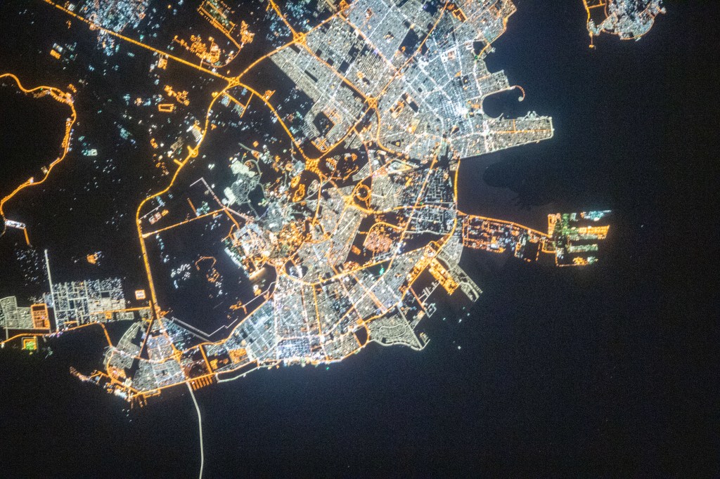 This nighttime view of Dammam, Saudi Arabia, was pictured from the International Space Station as it orbited 262 miles above the middle eastern nation. The fork-like structure at right is the King Abdulaziz Seaport.