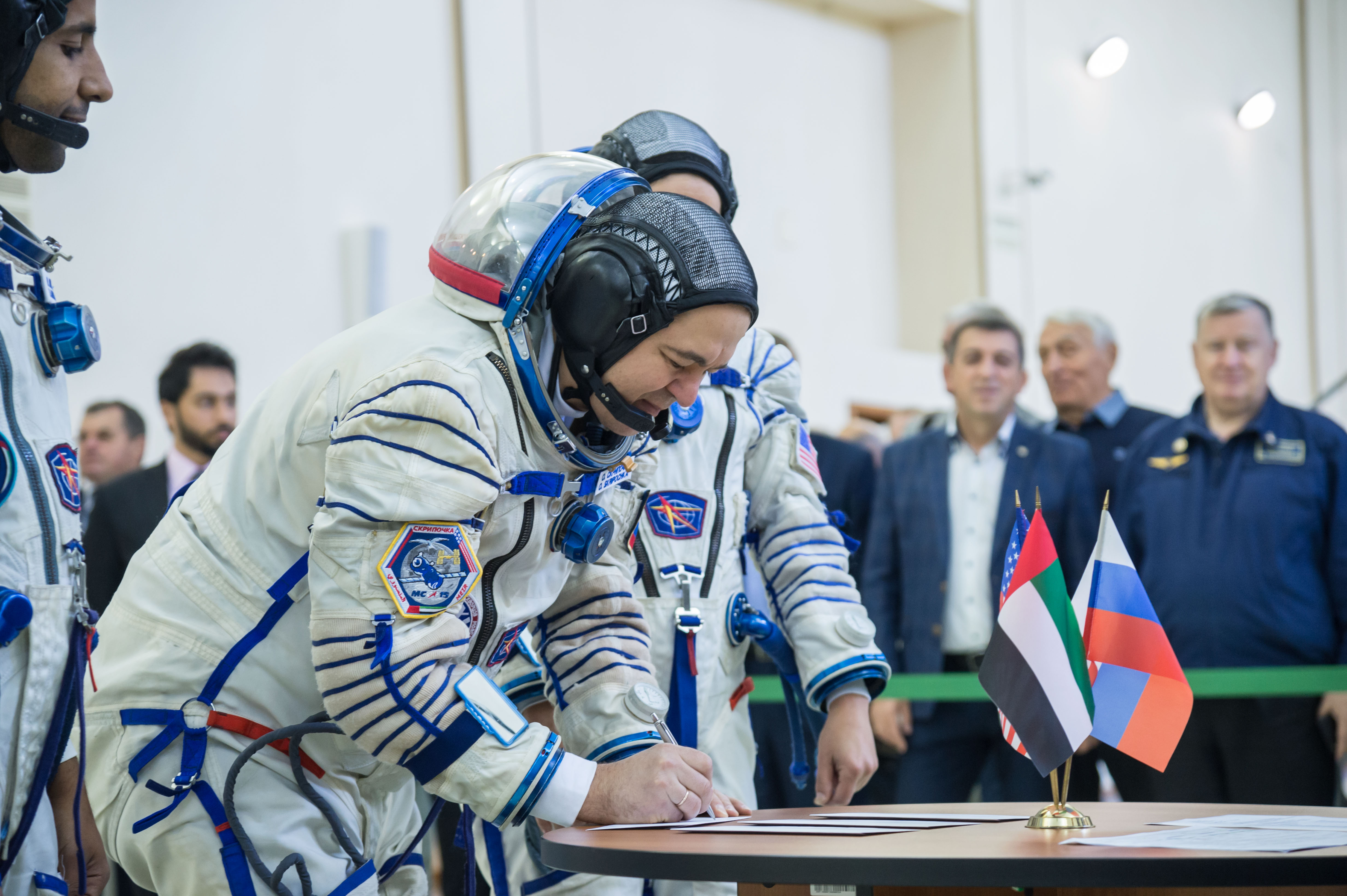 At the Gagarin Cosmonaut Training Center in Star City, Russia, Expedition 61 crewmember Oleg Skripochka of Roscosmos signs in for the second day of crew qualification exams Aug. 30. Along with Expedition 61 crewmember Jessica Meir of NASA and spaceflight participant Hazzaa Ali Almansoori of the United Arab Emirates, Skripochka will launch Sept. 25 on the Soyuz MS-15 spacecraft from the Baikonur Cosmodrome in Kazakhstan for a mission on the International Space Station.