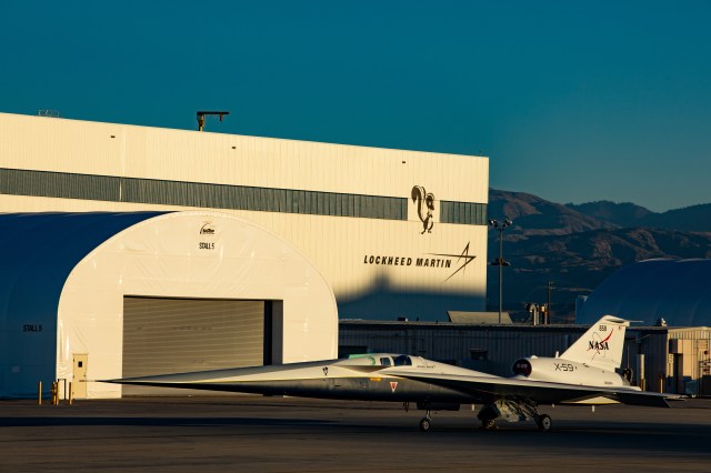 The X-59 aircraft is seen parked outside its hangar.