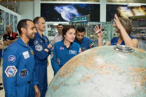 At the Baikonur Cosmodrome Museum in Kazakhstan, the prime and backup crewmembers for the next launch to the International Space Station receive a briefing Sept. 20 on the flight path of the Soyuz MS-15 rocket during pre-launch activities. From left to right are prime spaceflight participant Hazzaa Ali Almansoori of the United Arab Emirates, backup Expedition 61 crewmember Tom Marshburn of NASA, prime Expedition 61 crewmember Jessica Meir of NASA and backup spaceflight participant Sultan Al-Neyadi of the United Arab Emirates. Meir, Almansoori and Expedition 61 crewmember Oleg Skripochka of Roscosmos will launch Sept. 25 on the Soyuz MS-15 spacecraft for a mission on the International Space Station.