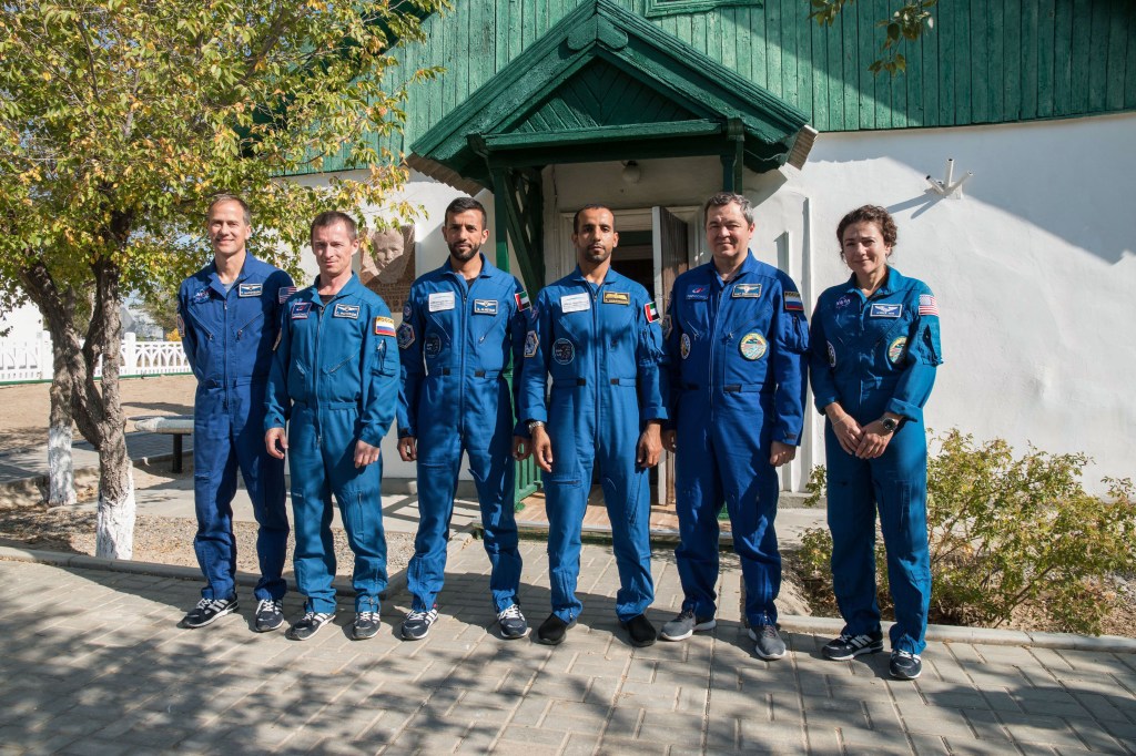At the Baikonur Cosmodrome in Kazakhstan, the prime and backup crewmembers for the next launch to the International Space Station pose for pictures Sept. 20 in front of the cottage in which Yuri Gagarin slept on the eve of his launch April 12, 1961 to become the first human to fly in space. From left to right are Expedition 61 backup crewmembers Tom Marshburn of NASA and Sergey Ryzhikov of Roscosmos and backup spaceflight participant Sultan Al-Neyadi of the United Arab Emirates and the prime crew, spaceflight participant Hazzaa Ali Almansoori of the United Arab Emirates and Expedition 61 crewmembers Oleg Skripochka of Roscosmos and Jessica Meir of NASA, who will launch Sept. 25 on the Soyuz MS-15 spacecraft for a mission on the International Space Station.