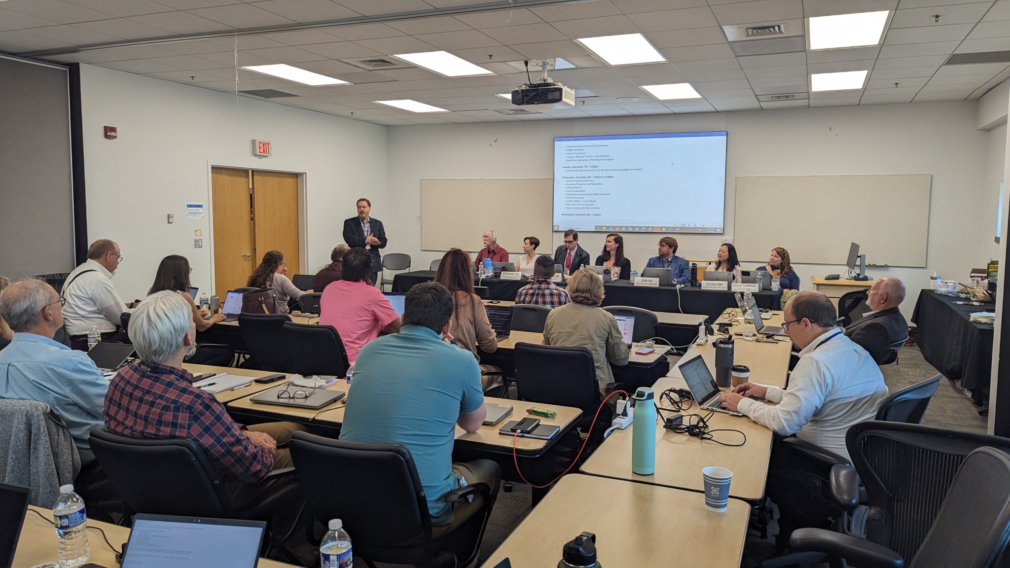 Kirt Costello, standing, speaks to a room of NASA’s commercial partners during the Payload Operations Workshop. Costello is the utilization manager for the commercial Low Earth Orbit Development Program.