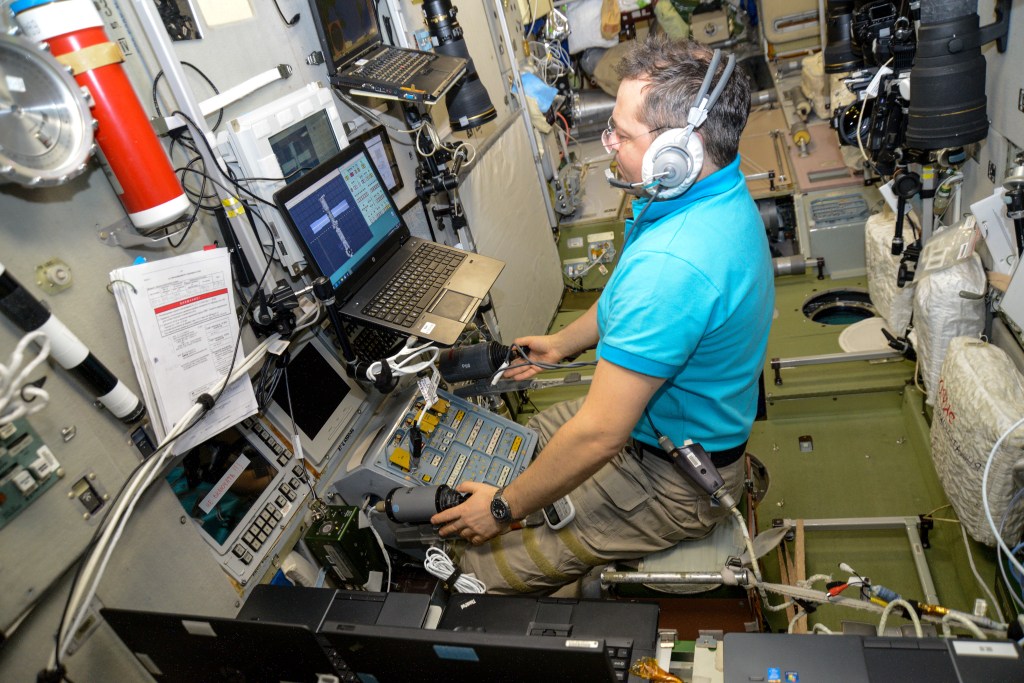 Roscosmos cosmonaut Oleg Skripochka trains on a computer inside the Zvezda service module for the unlikely scenario he would need to telerobotically maneuver a Russian cargo craft to a docking port on the International Space Station.
