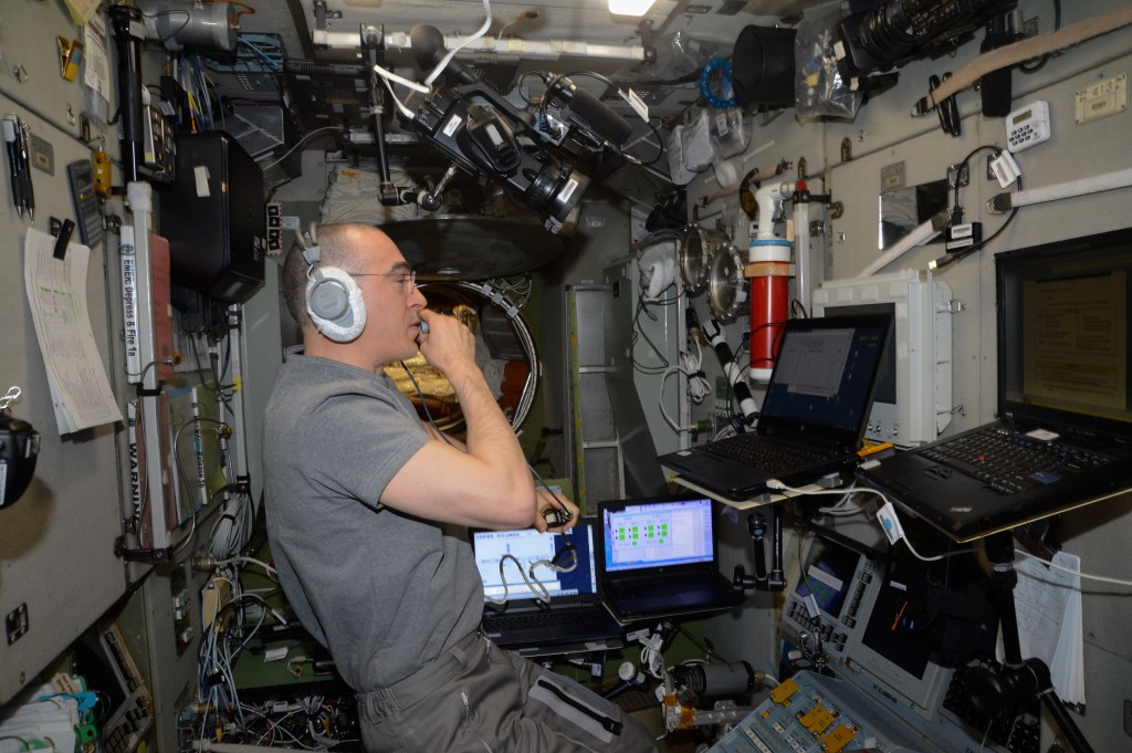 Roscosmos Flight Engineer Anatoly Ivanishin practices a simulated emergency evacuation of the International Space Station on a computer inside the Zvezda service module. Ivanishin spent the afternoon reviewing procedures for quickly entering the Soyuz MS-16 crew ship for a rapid undocking and Earth re-entry with crewmates Ivan Vagner of Roscosmos and Chris Cassidy of NASA (both out of frame).