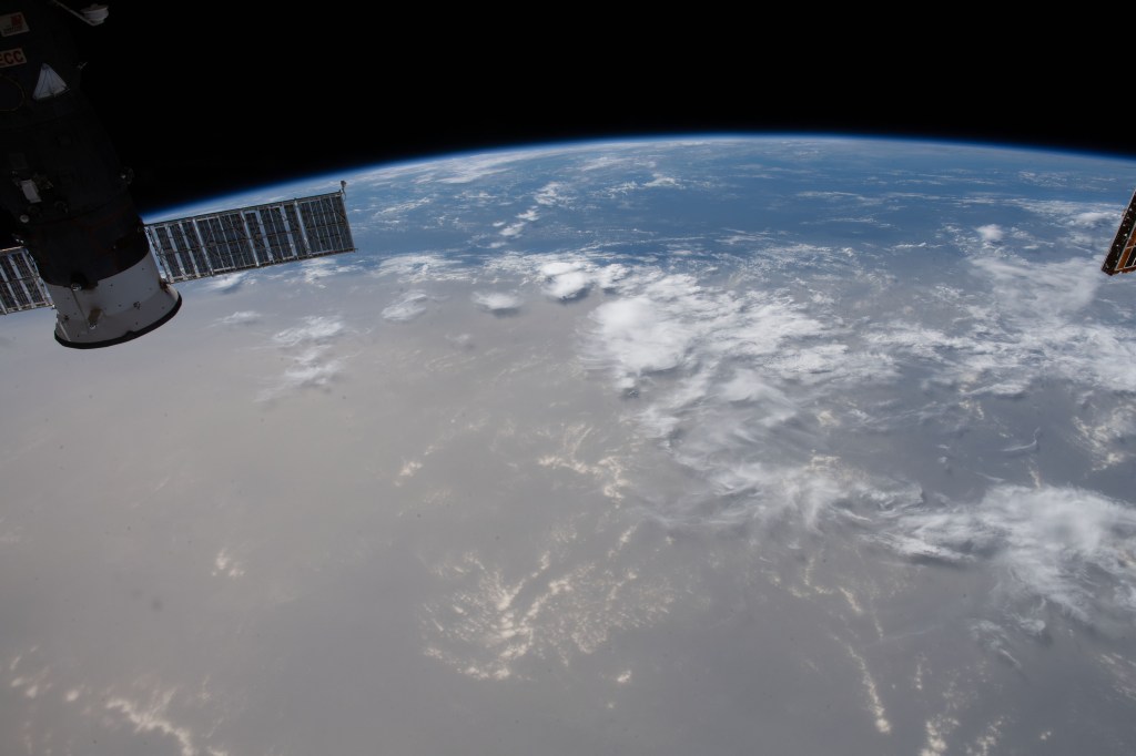 What looks like land is actually a Saharan dust cloud that has blown over the Atlantic Ocean and is nearing the Caribbean Sea.