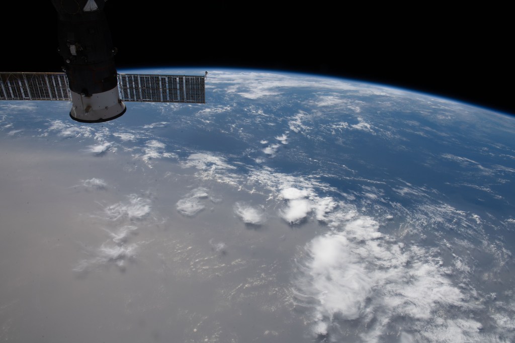 What looks like land is actually a Saharan dust cloud that has blown over the Atlantic Ocean and is nearing the Caribbean Sea.