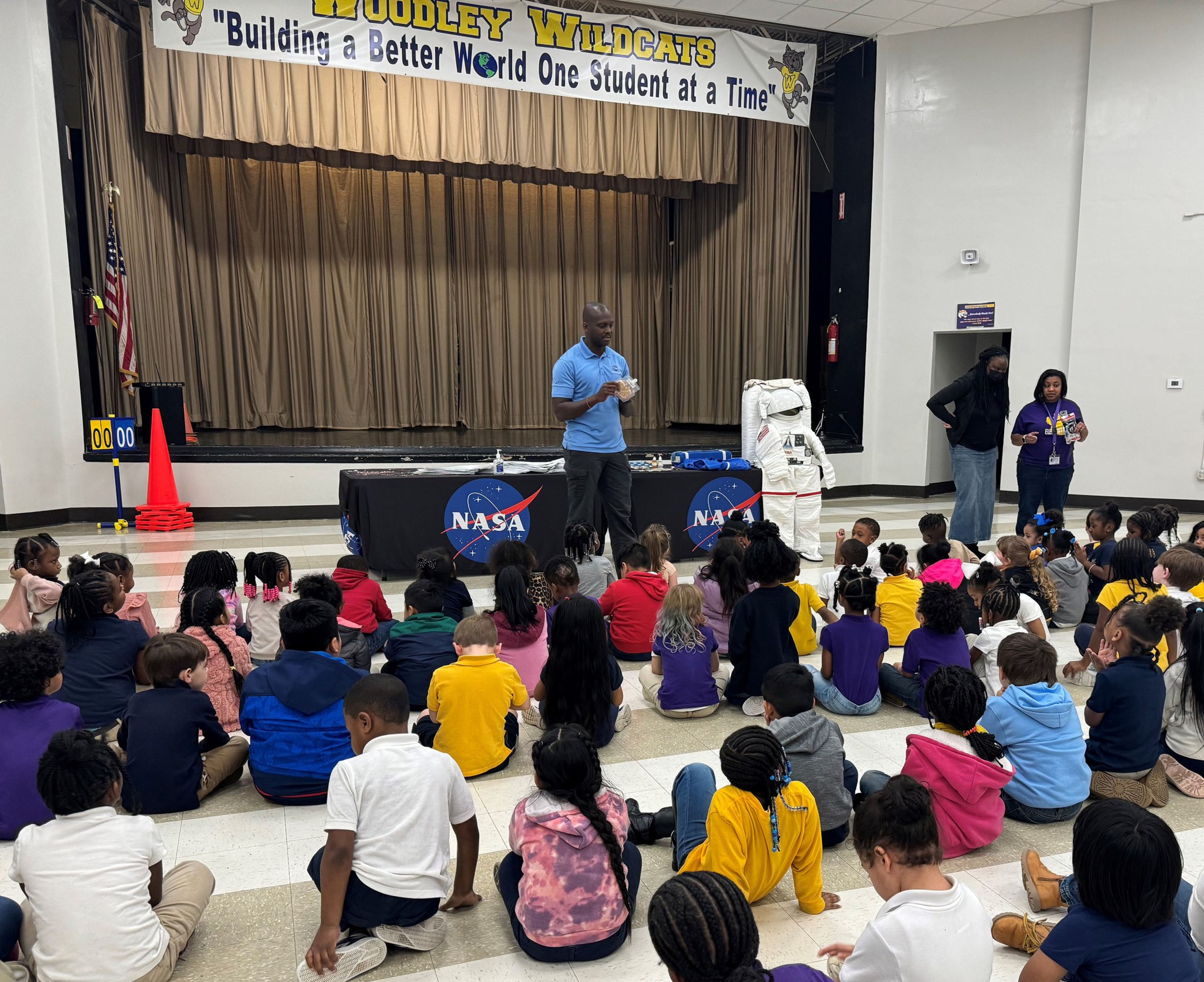 elementary students assemble to hear presentation