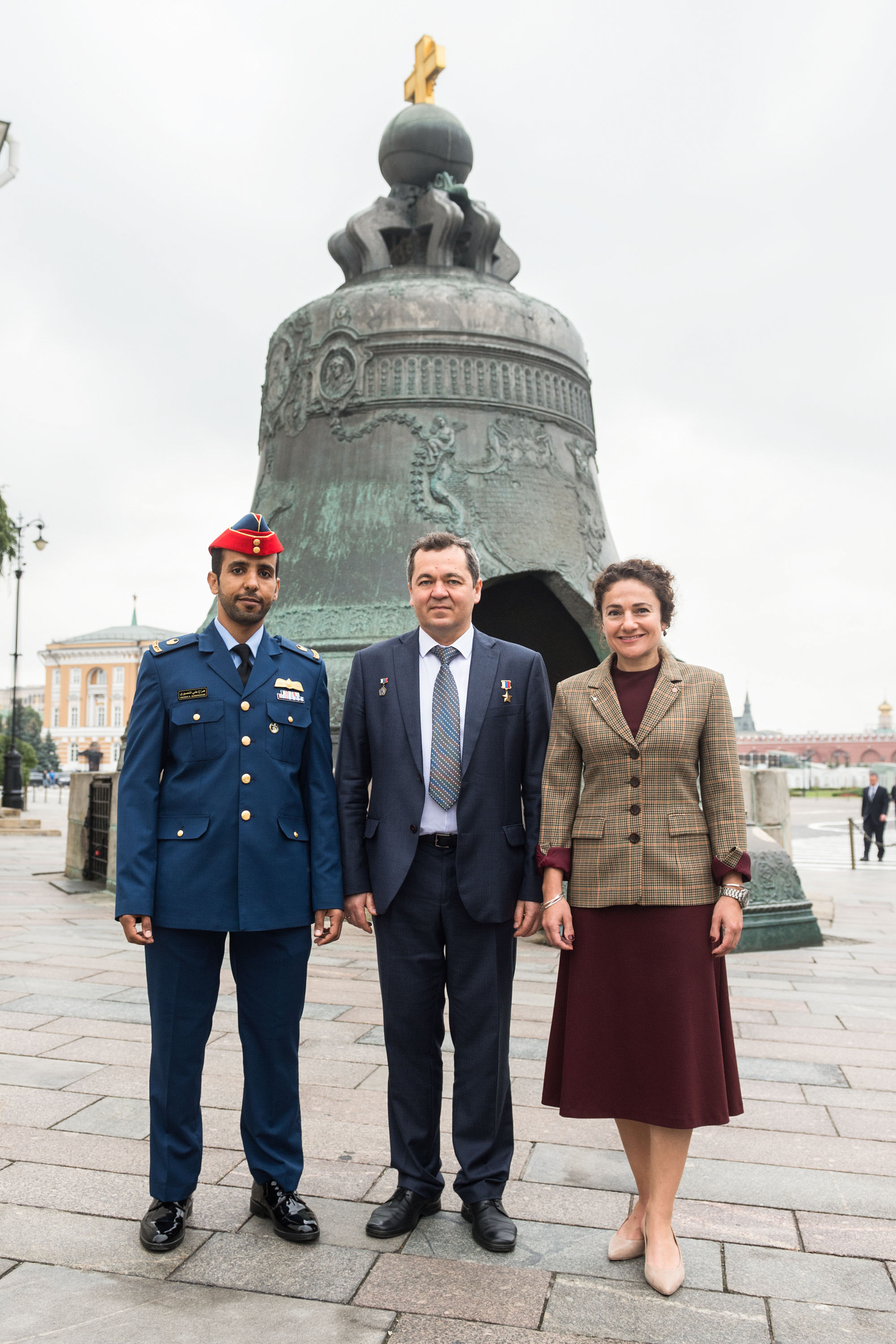 Inside the Kremlin in Moscow, spaceflight participant Hazzaa Ali Almansoori of the United Arab Emirates (left) and Expedition 61 crewmembers Oleg Skripochka of Roscosmos (center) and Jessica Meir of NASA (right) pose for pictures in front of the Tsar Bell Sept. 5 after laying flowers at the Wall where Russian space icons are interred. They will launch Sept. 25 from the Baikonur Cosmodrome in Kazakhstan on the Soyuz MS-15 spacecraft for a mission on the International Space Station. Image: Andrey Shelepin/Gagarin Cosmonaut Training Center.