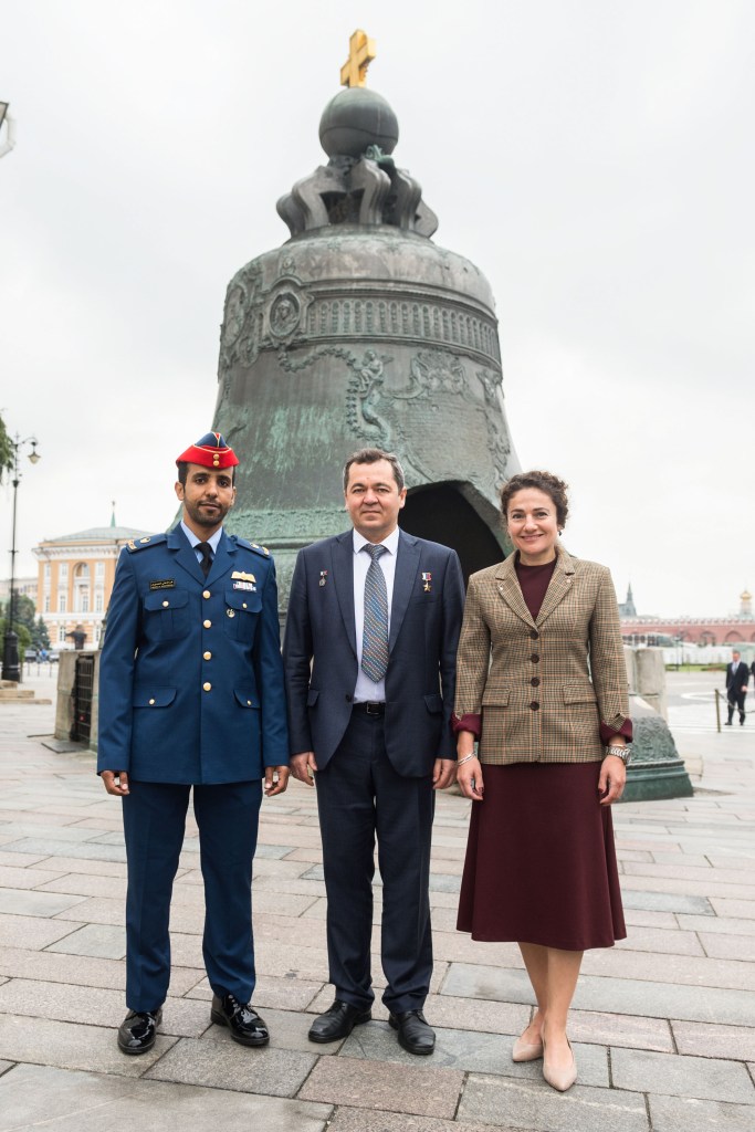 Inside the Kremlin in Moscow, spaceflight participant Hazzaa Ali Almansoori of the United Arab Emirates (left) and Expedition 61 crewmembers Oleg Skripochka of Roscosmos (center) and Jessica Meir of NASA (right) pose for pictures in front of the Tsar Bell Sept. 5 after laying flowers at the Wall where Russian space icons are interred. They will launch Sept. 25 from the Baikonur Cosmodrome in Kazakhstan on the Soyuz MS-15 spacecraft for a mission on the International Space Station. Image: Andrey Shelepin/Gagarin Cosmonaut Training Center.