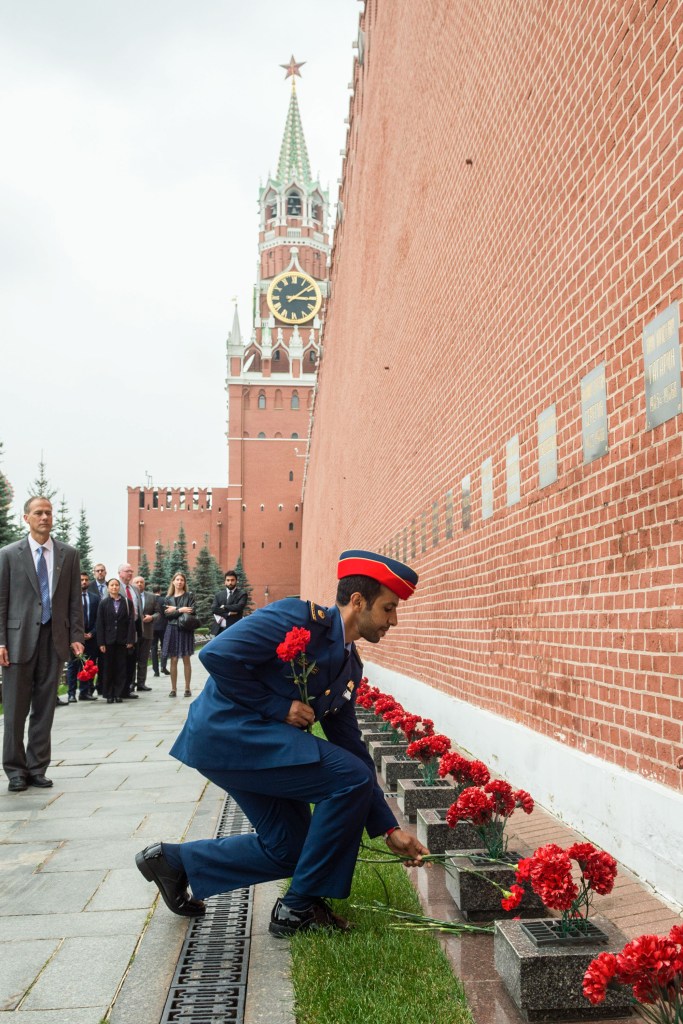 At the Kremlin Wall in Red Square in Moscow, spaceflight participant Hazzaa Ali Almansoori of the United Arab Emirates lays flowers where Russian space icons are interred Sept. 5 as part of traditional pre-flight ceremonies. Almansoori, and Expedition 61 crewmembers Jessica Meir of NASA and Oleg Skripochka of Roscosmos will launch Sept. 25 from the Baikonur Cosmodrome in Kazakhstan on the Soyuz MS-15 spacecraft for a mission on the International Space Station.
