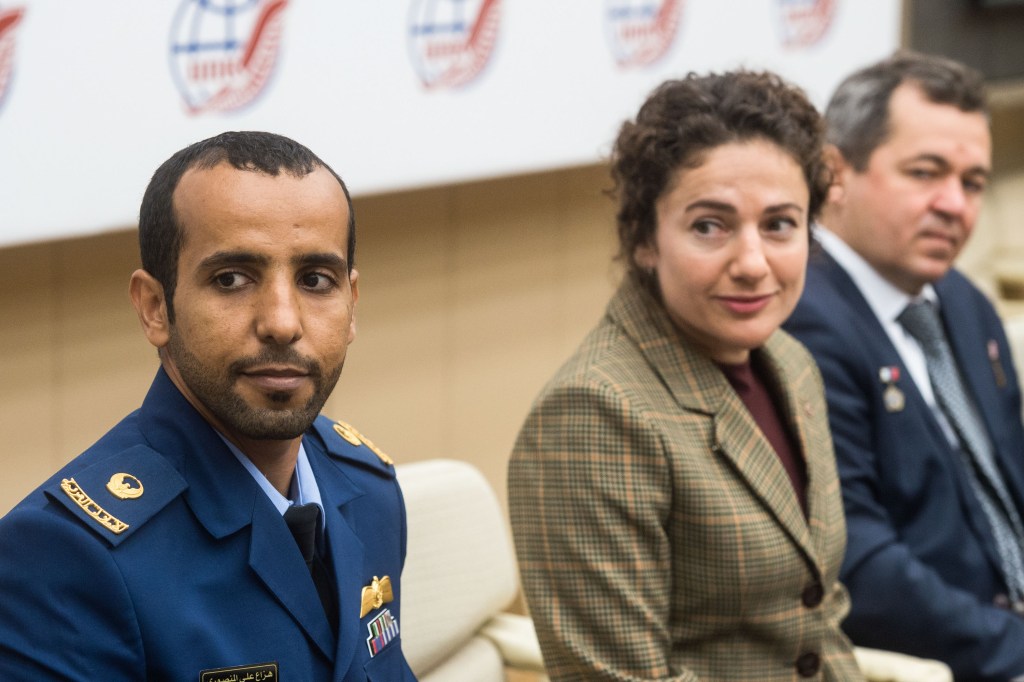 At the Gagarin Cosmonaut Training Center in Star City, Russia, spaceflight participant Hazzaa Ali Almansoori of the United Arab Emirates (left), Jessica Meir of NASA (center) and Oleg Skripochka of Roscosmos listen to a reporter’s question Sept. 5 as part of a pre-flight news conference. They will launch Sept. 25 from the Baikonur Cosmodrome in Kazakhstan on the Soyuz MS-15 spacecraft for a mission on the International Space Station.