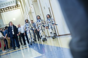 At the Gagarin Cosmonaut Training Center in Star City, Russia, spaceflight participant Hazzaa Ali Almansoori of the United Arab Emirates (left), Oleg Skripochka of Roscosmos (center) and Jessica Meir of NASA (right) report for duty on the second day of crew qualification exams Aug. 30. They will launch Sept. 25 on the Soyuz MS-15 spacecraft from the Baikonur Cosmodrome in Kazakhstan for a mission on the International Space Station.