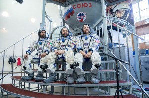 At the Gagarin Cosmonaut Training Center in Star City, Russia, spaceflight participant Hazzaa Ali Almansoori of the United Arab Emirates (left), Oleg Skripochka of Roscosmos (center) and Jessica Meir of NASA (right) listen to reporters’ questions Aug. 30 during crew qualification exams. They will launch Sept. 25 on the Soyuz MS-15 spacecraft from the Baikonur Cosmodrome in Kazakhstan for a mission on the International Space Station.