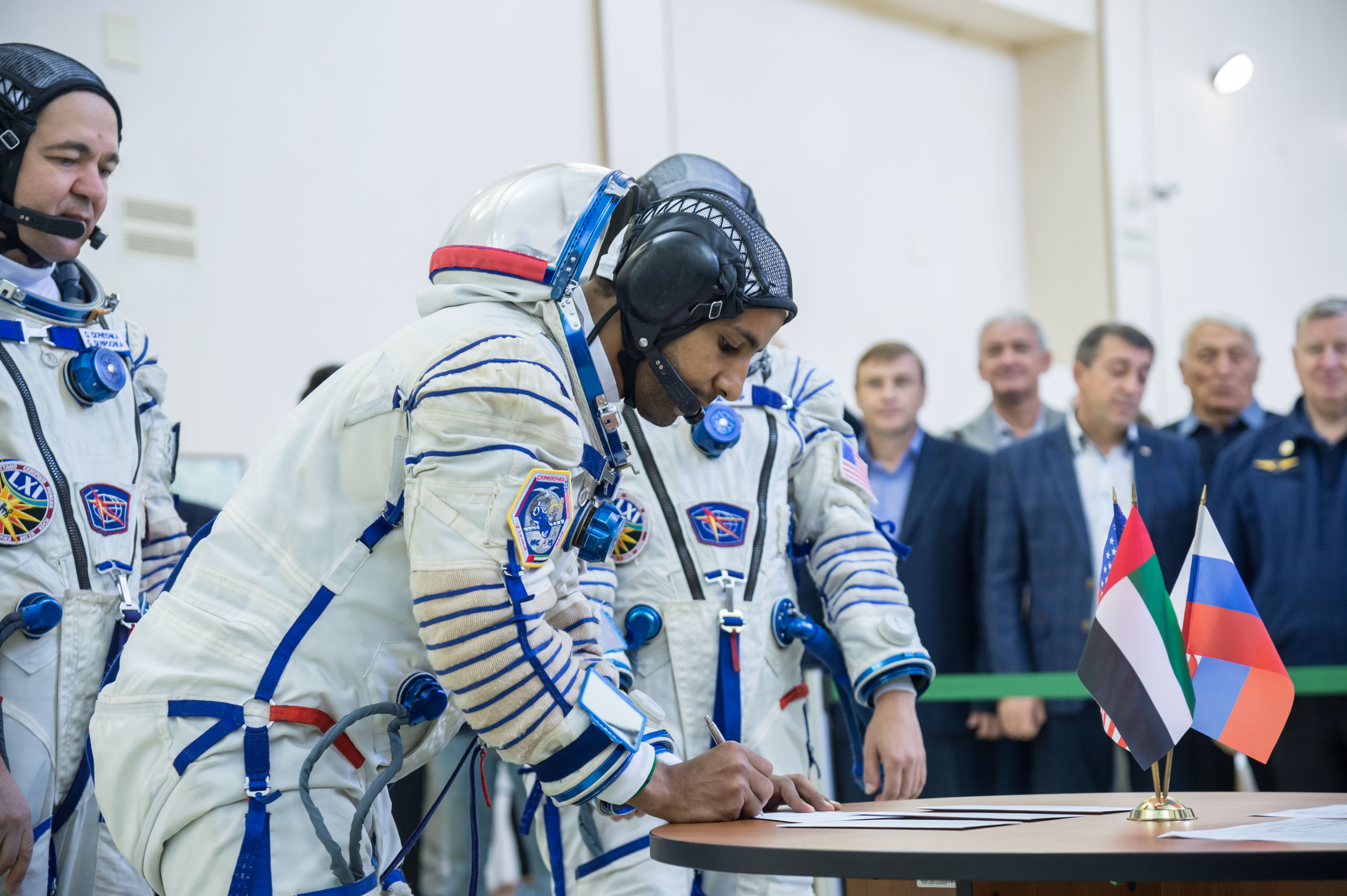 At the Gagarin Cosmonaut Training Center in Star City, Russia, spaceflight participant Hazzaa Ali Almansoori of the United Arab Emirates signs in for the second day of crew qualification exams Aug. 30. Along with Expedition 61 crewmembers Oleg Skripochka of Roscosmos and Jessica Meir of NASA, Almansoori will launch Sept. 25 on the Soyuz MS-15 spacecraft from the Baikonur Cosmodrome in Kazakhstan for a mission on the International Space Station.