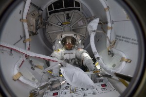 NASA astronaut Christina Koch enters the Quest airlock moments before completing her first spacewalk to upgrade the International Space Station's power storage capacity. She and fellow spacewalker Nick Hague (out of frame) of NASA worked outside in the vacuum of space for six hours and 45 minutes to continue swapping batteries and install adapter plates on the station's Port-4 truss structure.