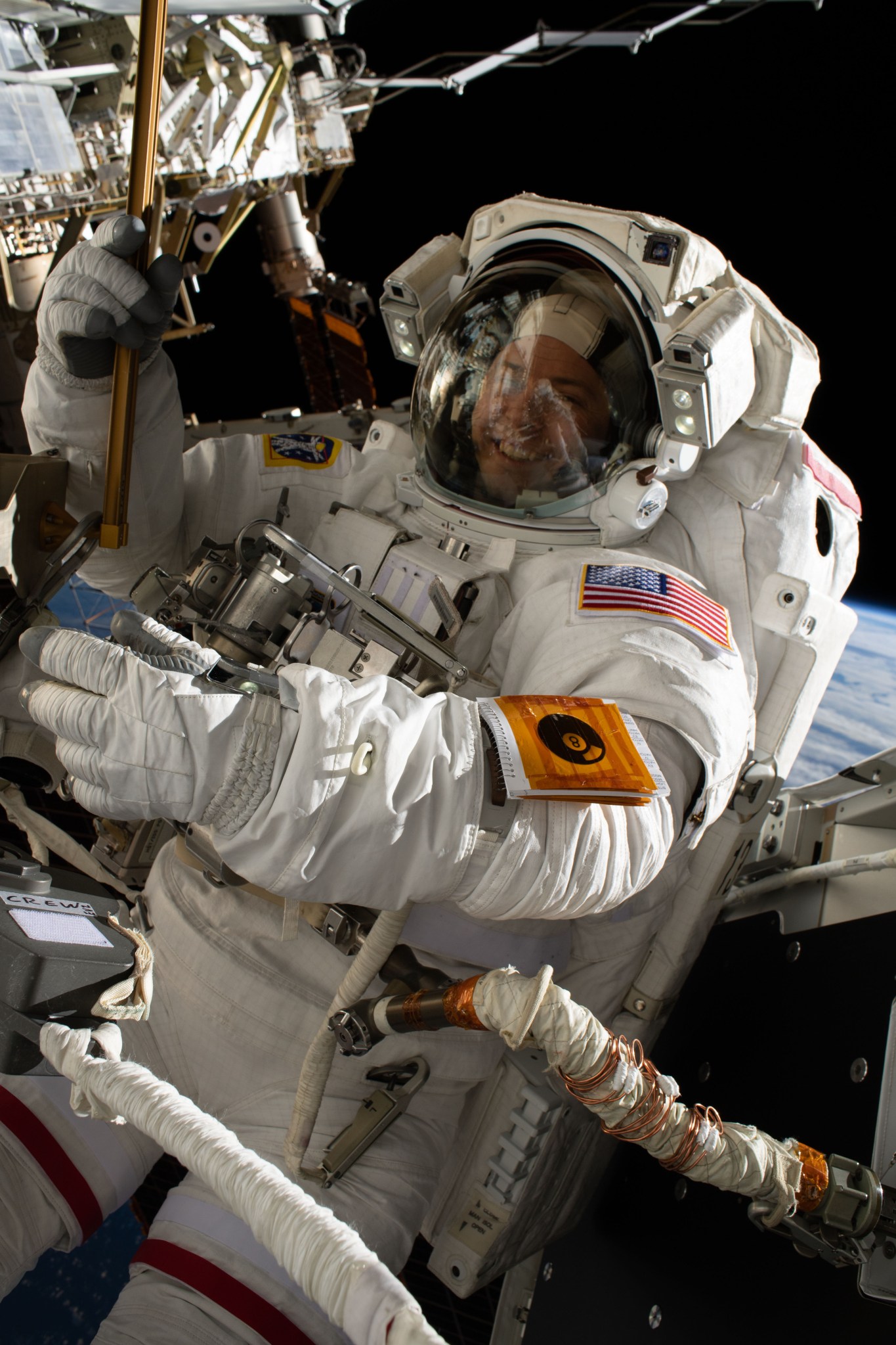 NASA astronaut Nick Hague participates in his second spacewalk to upgrade the International Space Station's power storage capacity. He and fellow spacewalker Christina Koch (out of frame) of NASA worked outside in the vacuum of space for six hours and 45 minutes to continue swapping batteries and install adapter plates on the station's Port-4 truss structure.