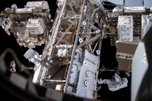 Spacewalkers Andrew Morgan (left) and Luca Parmitano (bottom right) work on get-ahead tasks after completing thermal repairs on the Alpha Magnetic Spectrometer, a dark matter and antimatter detector.
