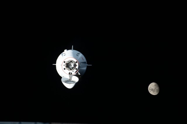 iss068e014262 (Oct. 6, 2022) --- The SpaceX Dragon Endurance crew ship, carrying four Crew-5 members, approaches the International Space Station with the waxing gibbous Moon pictured in the background. Credit: NASA/Kjell Lindgren