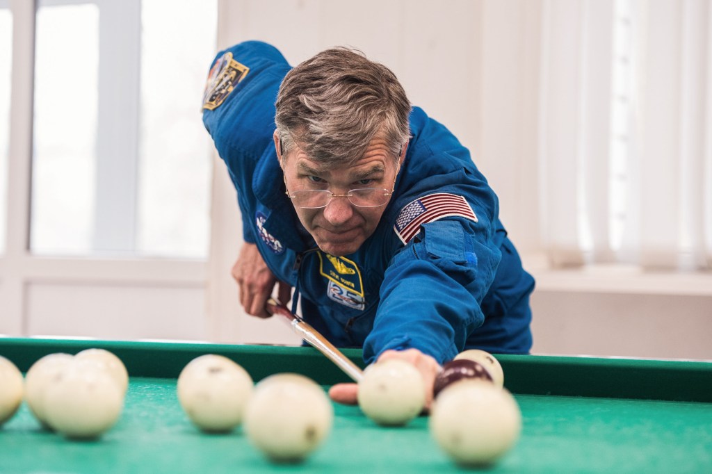 At the Cosmonaut Hotel crew quarters in Baikonur, Kazakhstan, Expedition 63 backup crewmember Steve Bowen of NASA plays a game of billiards April 1 as he takes a break from pre-launch training. Bowen and Sergey Ryzhikov and Andrei Babkin of Roscosmos are the backups to the prime crew, Chris Cassidy of NASA and Anatoly Ivanishin and Ivan Vagner of Roscosmos, who will launch April 9 on the Soyuz MS-16 spacecraft from the Baikonur Cosmodrome in Kazakhstan for a six-and-a-half month mission on the International Space Station. Credit: Andrey Shelepin/Gagarin Cosmonaut Training Center.