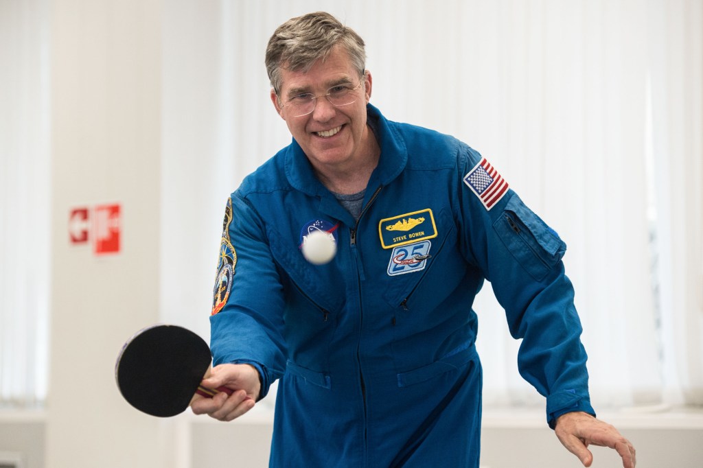 At the Cosmonaut Hotel crew quarters in Baikonur, Kazakhstan, Expedition 63 backup crewmember Steve Bowen of NASA plays a game of ping-pong April 1 as he takes a break from pre-launch training. Bowen and Sergey Ryzhikov and Andrei Babkin of Roscosmos are the backups to the prime crew, Chris Cassidy of NASA and Anatoly Ivanishin and Ivan Vagner of Roscosmos, who will launch April 9 on the Soyuz MS-16 spacecraft from the Baikonur Cosmodrome in Kazakhstan for a six-and-a-half month mission on the International Space Station. Credit: Andrey Shelepin/Gagarin Cosmonaut Training Center.