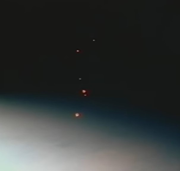 The six spheres fly away from the shuttle