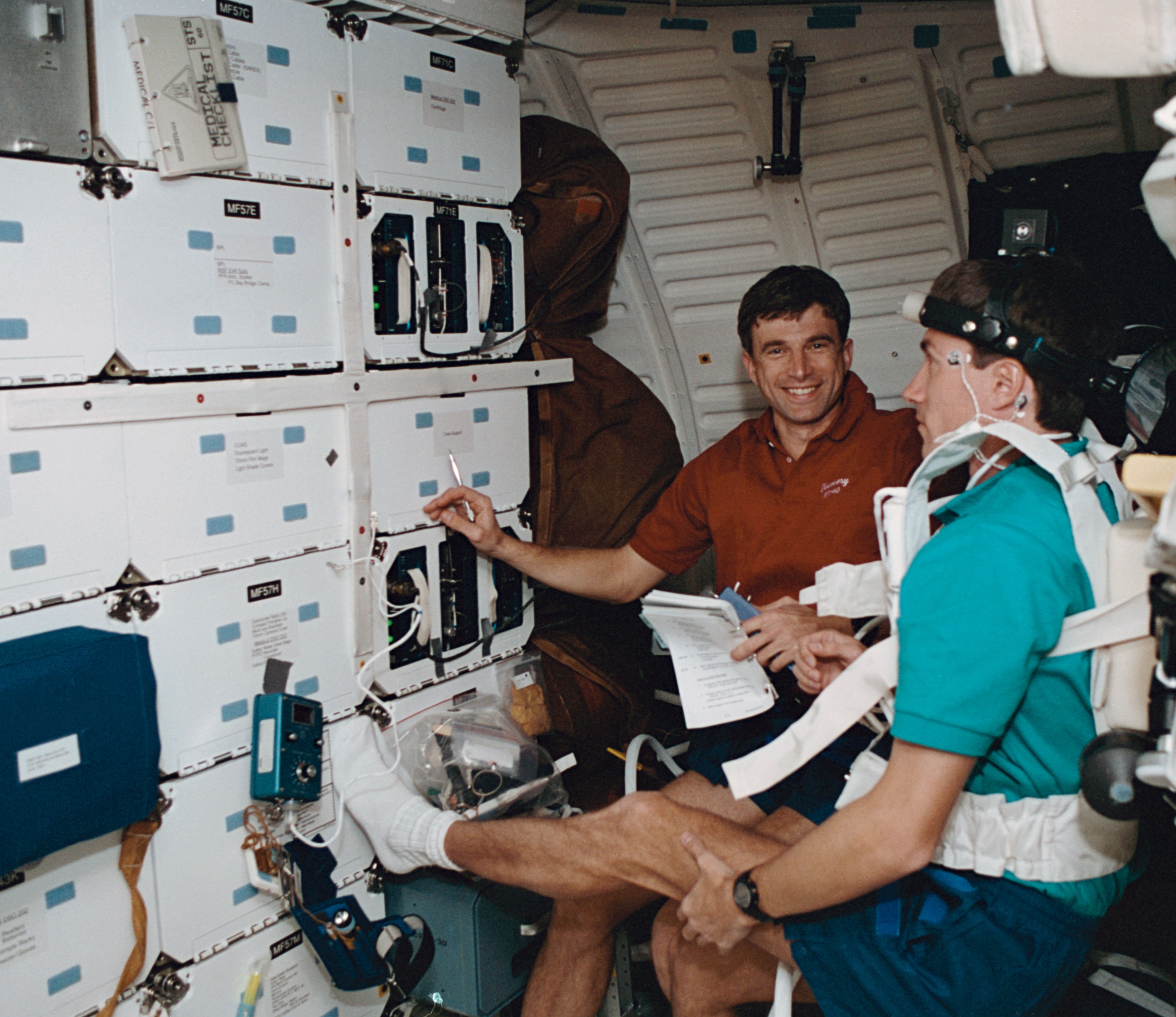 Ronald M. Sega monitors Sergei K. Krikalev as he performs a neurosensory investigation