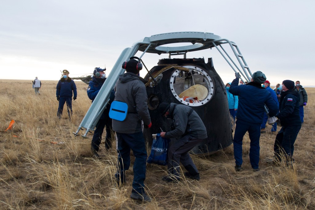 nhq202010220011 (Oct. 22, 2020) --- Russian Search and Rescue teams arrive at the Soyuz MS-16 spacecraft shortly after it landed in a remote area near the town of Zhezkazgan, Kazakhstan with Expedition 63 crew members Chris Cassidy of NASA, Anatoly Ivanishin and Ivan Vagner of Roscosmos, Thursday, October 22, 2020, Kazakh time (Oct. 21 Eastern time). Cassidy, Ivanishin and Vagner returned after 196 days in space having served as Expedition 62-63 crew members onboard the International Space Station.