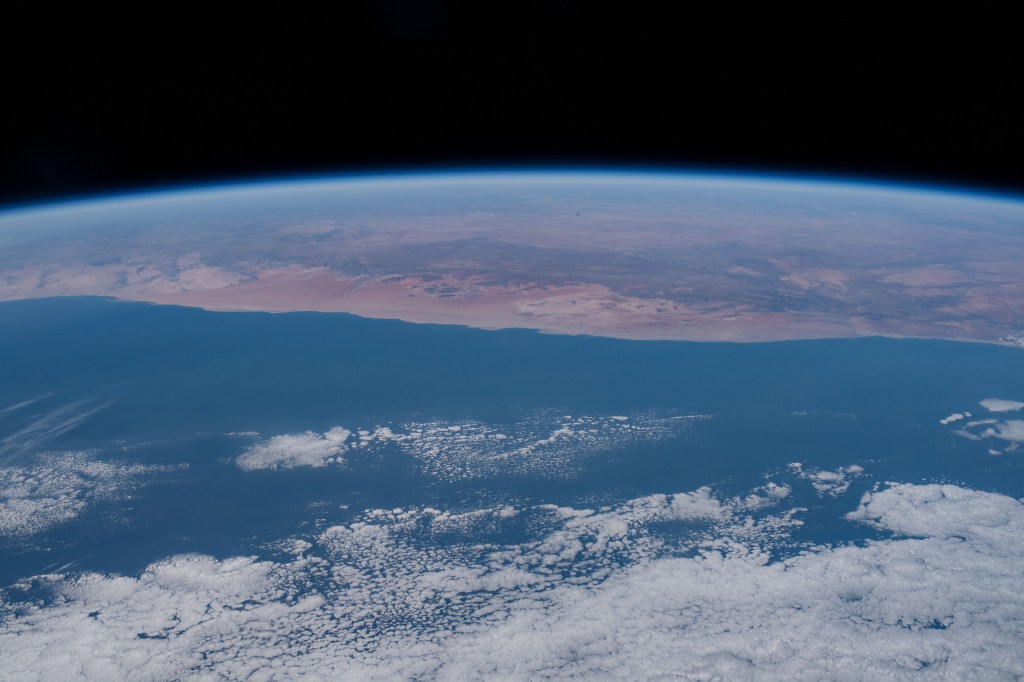 This view from the International Space Station looks over the Atlantic Ocean and across the southwest coast of Africa.