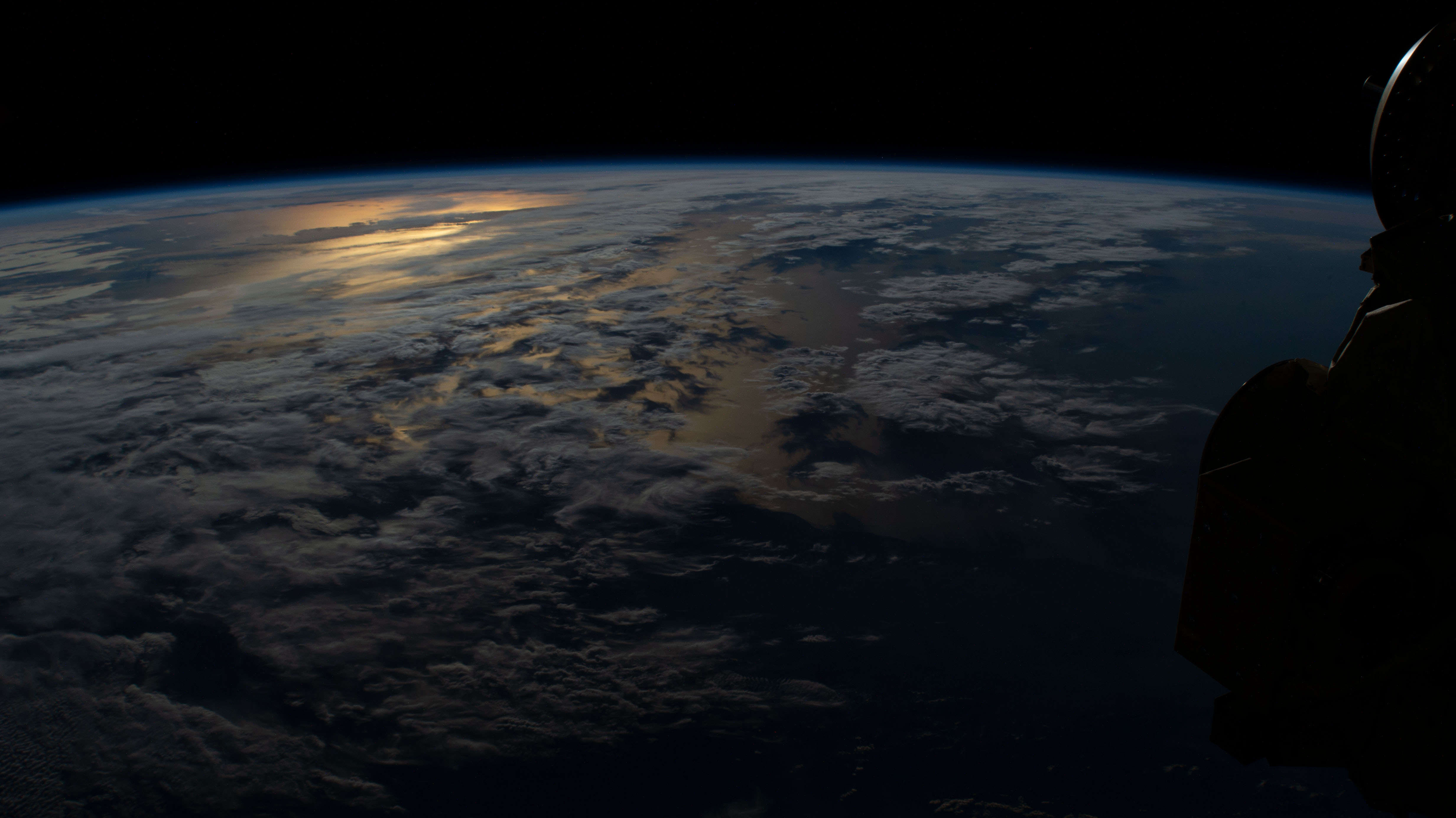 The International Space Station orbits 264 miles above Argentina on its northeast track across South America as this photograph looks across the Atlantic Ocean during an orbital sunset.