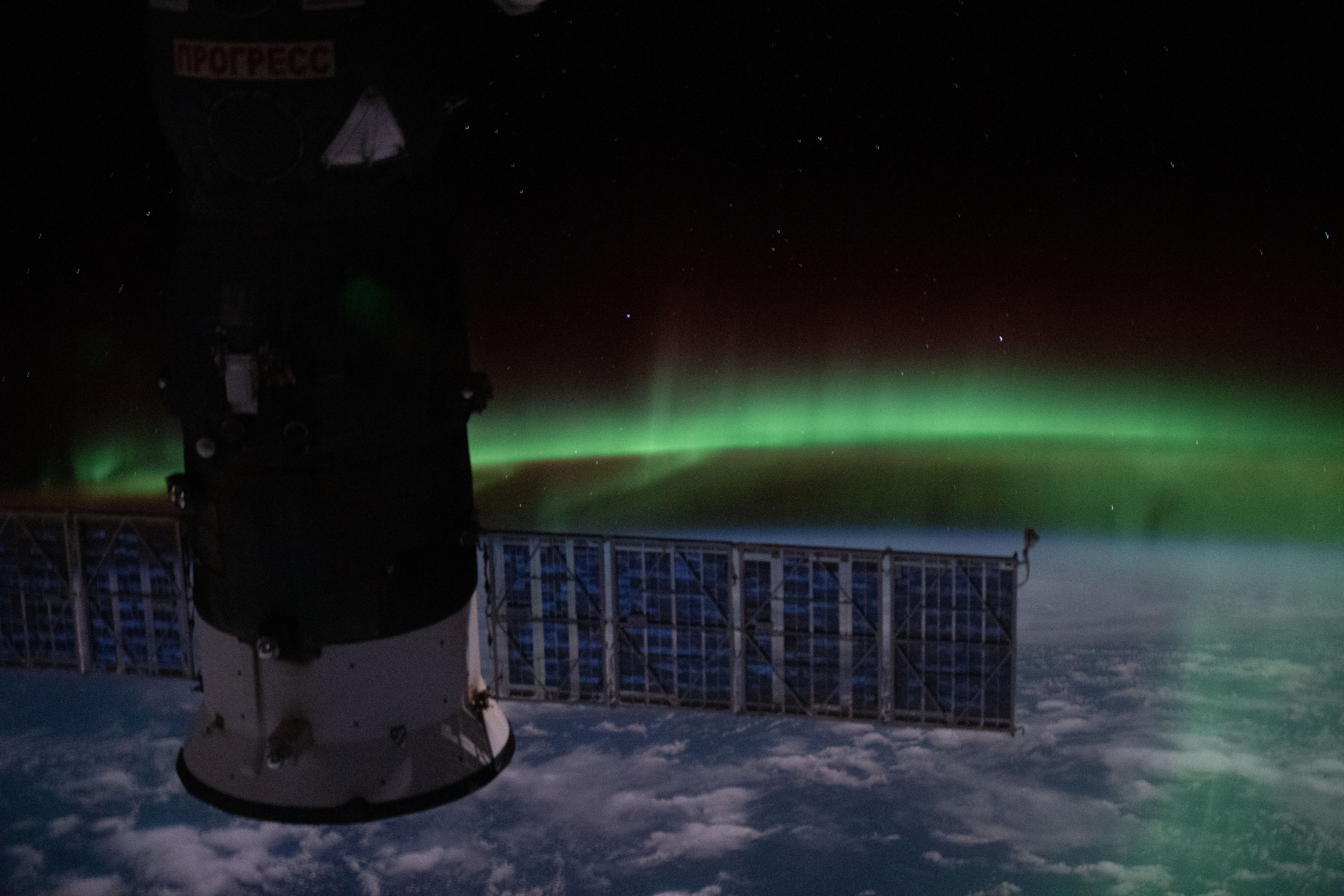 This orbital nighttime view from the International Space Station as it orbited above the Indian Ocean shows the "aurora australis" and a starry sky with Russia's Progress 74 resupply ship in the foreground.