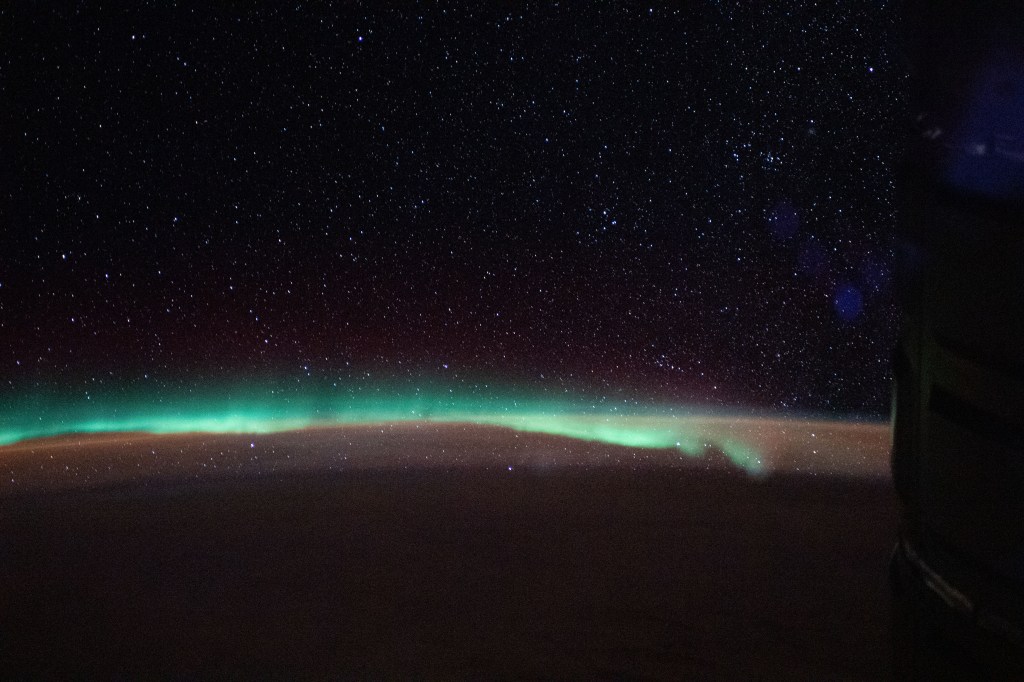 The aurora australis, or "southern lights," highlights a starry nighttime orbital pass as the International Space Station orbited 267 miles above the Indian Ocean southeast of Madagascar.