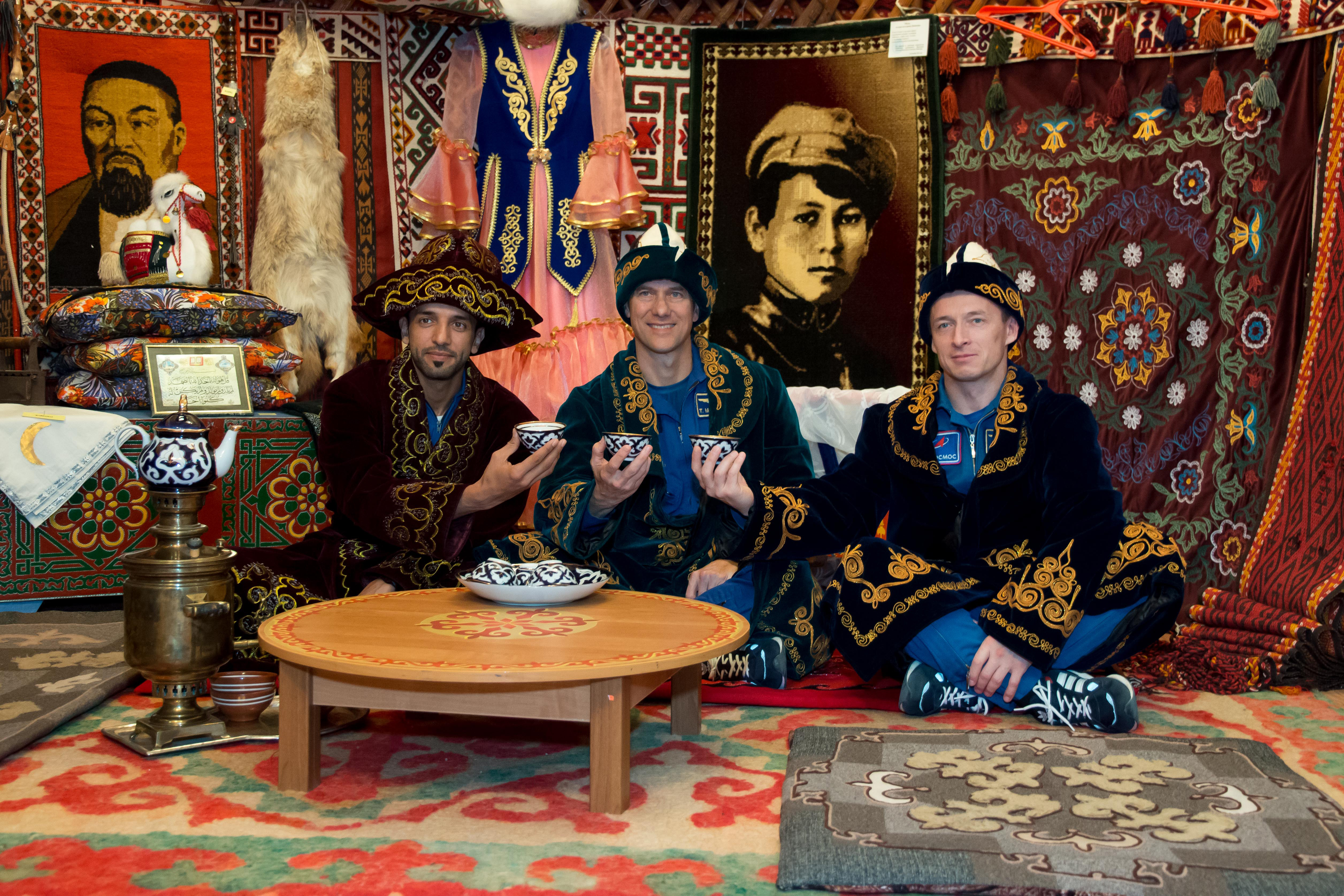 At the Baikonur Museum in the town of Baikonur, Kazakhstan, the backup crewmembers for the next launch to the International Space Station enjoy an afternoon cup of tea Sept. 12 in traditional Kazakh garb during a pre-launch tour. Spaceflight participant Sultan Al-Neyadi of the United Arab Emirates (left), Tom Marshburn of NASA (center) and Sergey Ryzhikov of Roscosmos (right) are the backups to the prime Expedition 61 crew, Oleg Skripochka of Roscosmos and Jessica Meir of NASA and spaceflight participant Hazzaa Ali Almansoori of the United Arab Emirates, who will launch Sept. 25 on the Soyuz MS-15 spacecraft for a mission on the International Space Station.