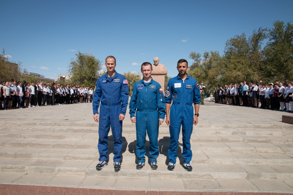 In the town of Baikonur, Kazakhstan, the backup crewmembers for the next launch to the International Space Station pose for pictures Sept. 12 in front of a statue of Sergei Korolev, the Russian great designer, as part of traditional pre-launch activities. Tom Marshburn of NASA (left), Sergey Ryzhikov of Roscosmos (center) and spaceflight participant Sultan Al-Neyadi of the United Arab Emirates are the backups to the prime Expedition 61 crew, Oleg Skripochka of Roscosmos and Jessica Meir of NASA and spaceflight participant Hazzaa Ali Almansoori of the United Arab Emirates, who will launch Sept. 25 on the Soyuz MS-15 spacecraft for a mission on the International Space Station.