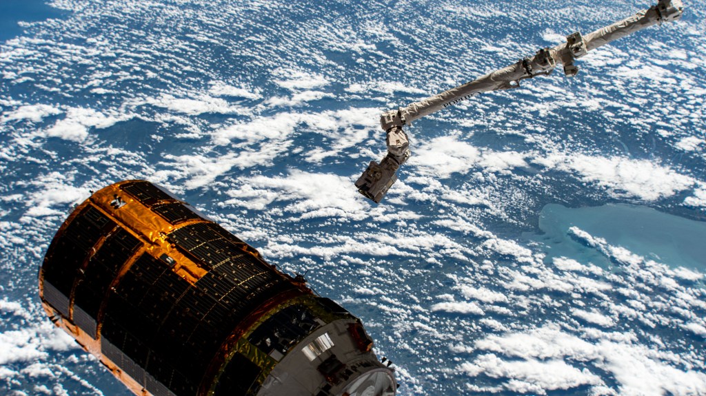 The Canadarm2 robotic arm backs away from JAXA's (Japan Aerospace Exploration Agency) H-II Transfer Vehicle-9 (HTV-9) after releasing it into Earth orbit. The HTV-9 resupply ship arrived at the International Space Station on May 25 delivering four tons of food, fuel, crew supplies and station experiments to the Expedition 63 crew.
