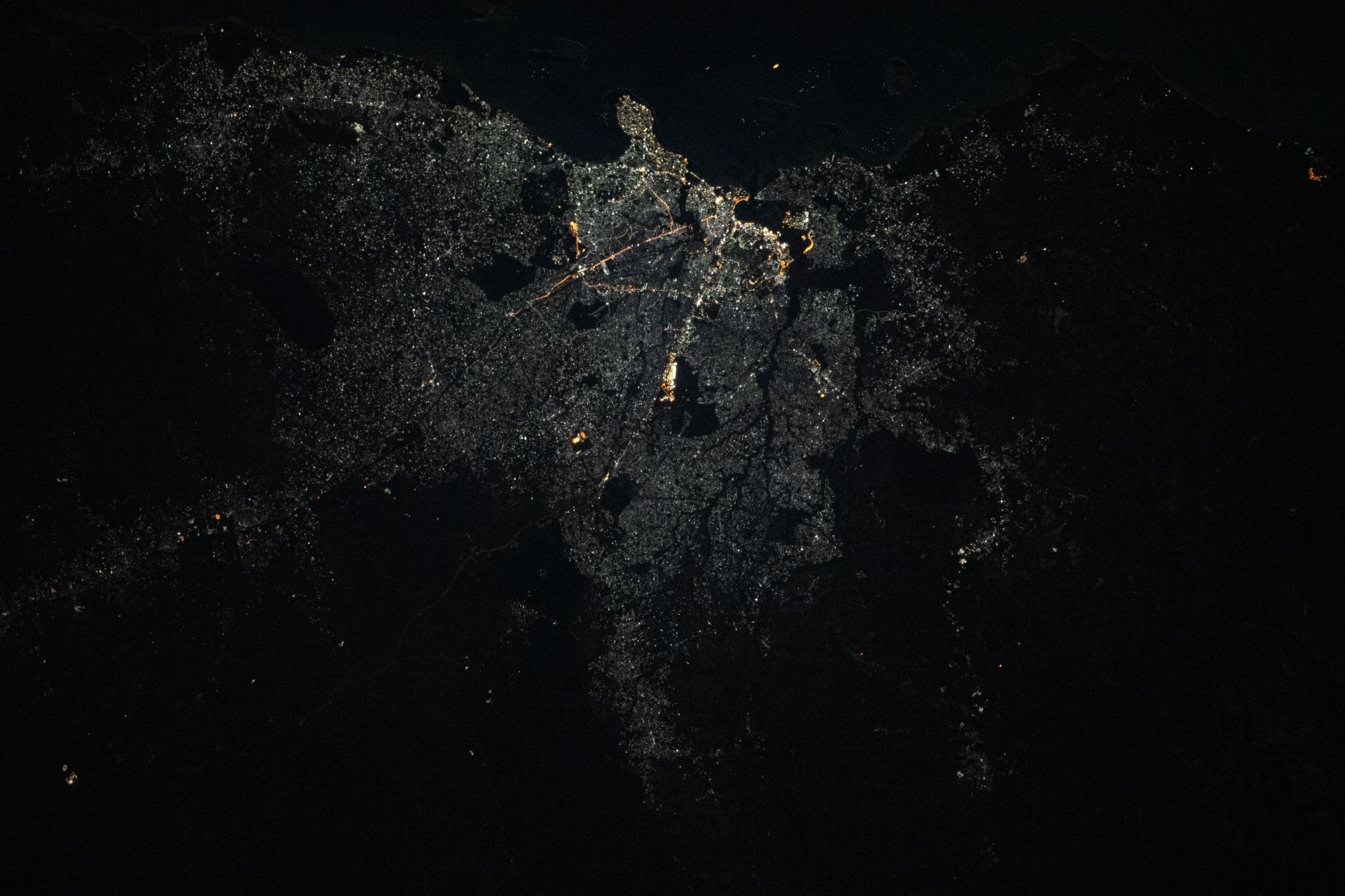 The city of Dar Es Salaam, a major commercial port on the Indian Ocean coast of Tanzania, is pictured during an orbital night period as the International Space Station soared above the eastern coast of Africa.