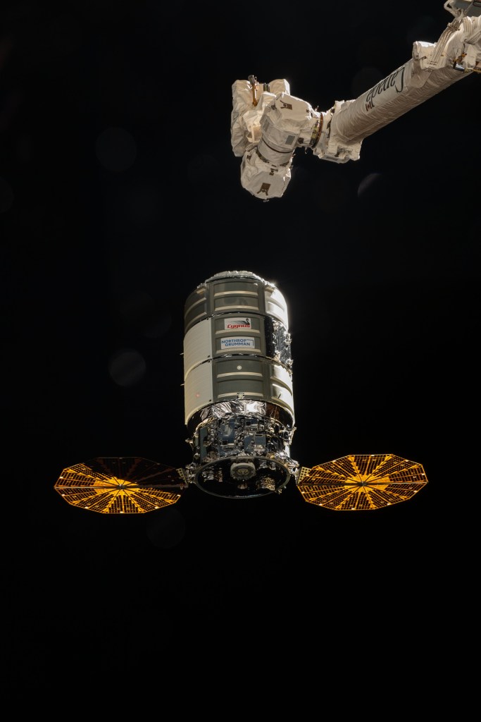 The Northrop Grumman Cygnus space freighter approaches the International Space Station as the Canadarm2 robotic arm is poised to reach out and capture the cargo vehicle.