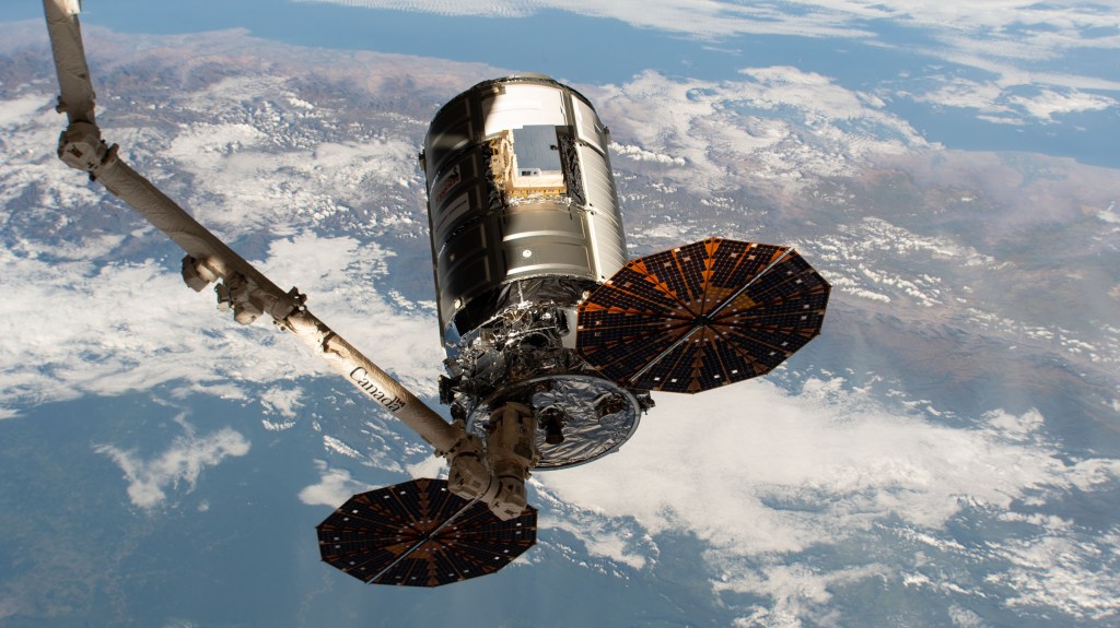 The Northrop Grumman (NG)-13 Cygnus vehicle (S.S. Robert Henry Lawrence Jr.) cargo craft is pictured in the grips of the Canadarm2 robotic arm shortly before its departure from the International Space Station (ISS) for a destructive re-entry over the South Pacific Ocean. Seen in the view is the High Definition Earth Viewing (HDEV) payload attached to the Cygnus. The HDEV experiment, deployed and activated in April 2014, placed four commercially available HD cameras on the exterior of the space station and used them to stream live video of Earth for viewing online. Almost 350 million viewers visited the site over HDEV’s life span.