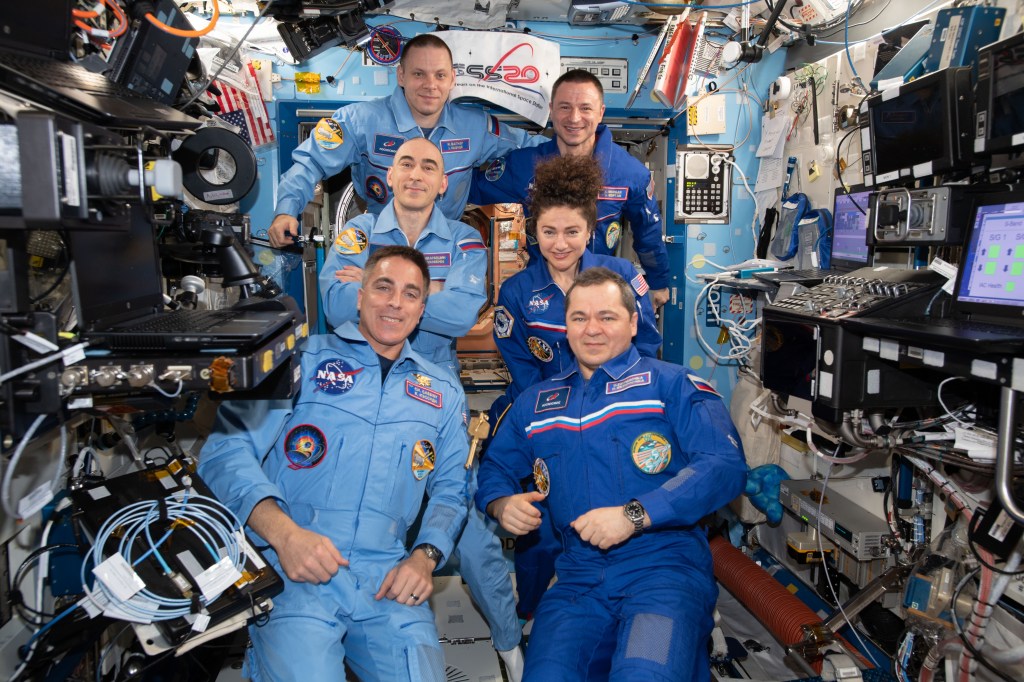 The Expedition 62 and 63 crews pose together moments after Roscosmos cosmonaut Oleg Skripochka (bottom right) handed over station command to NASA astronaut Chris Cassidy (bottom left). On the right side, are Expedition 62 crewmembers Skripochka with NASA astronauts Jessica Meir and Andrew Morgan. On the left, are Expedition 63 crewmembers Cassidy with Roscosmos cosmonauts Anatoly Ivanishin and Ivan Vagner. The Expedition 62 crew returned to Earth on April 17, 2020, at 1:16 a.m. EDT (11:16 a.m. Kazakh time).
