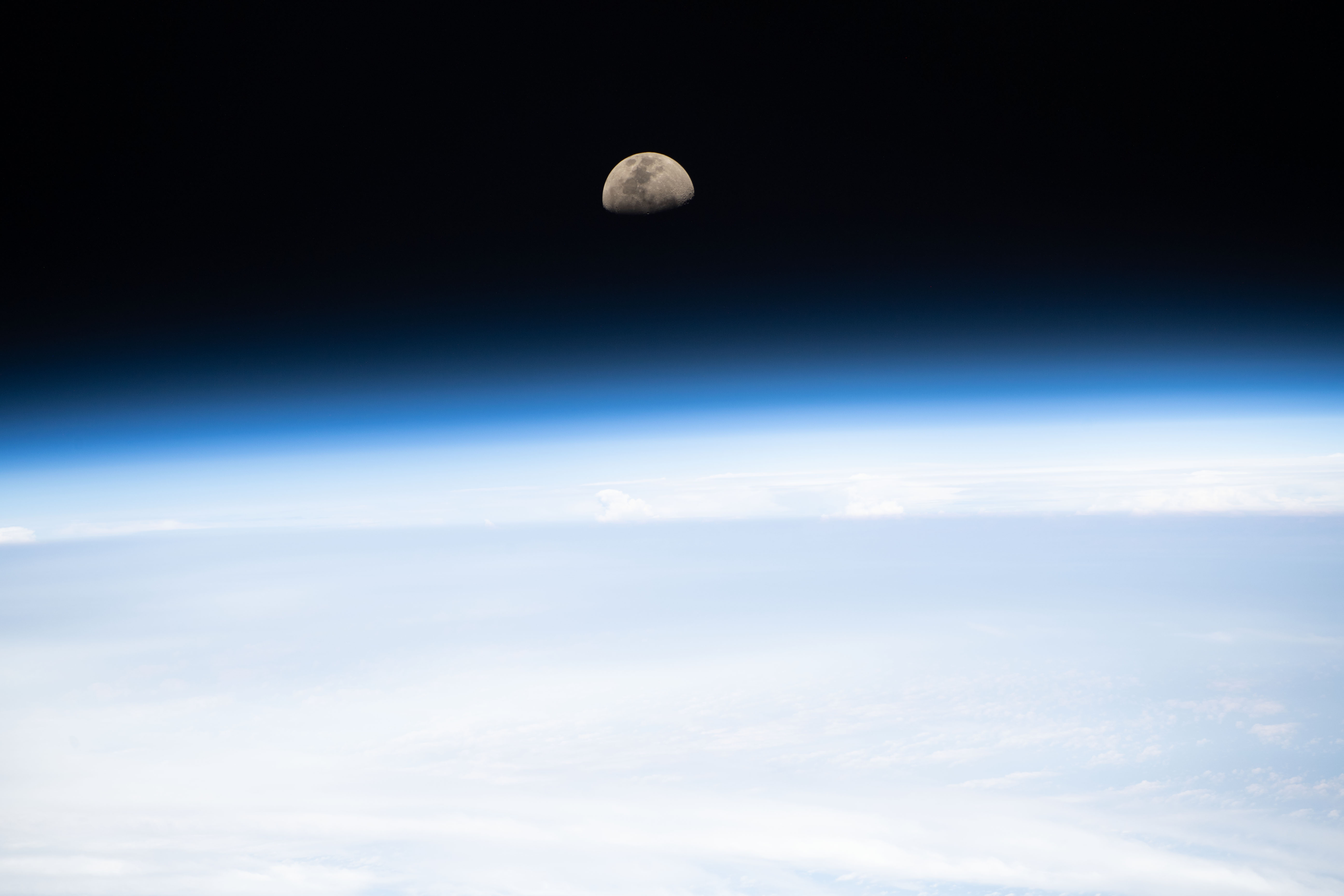 A first quarter Moon is pictured as the International Space Station orbited 265 miles above the South Pacific.