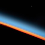 The first rays of an orbital sunrise shine illuminates the Earth's limb and highlights the atmosphere as the International Space Station orbits 259 miles above the central United States.