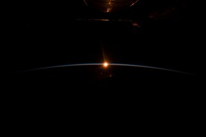 iss068e038496 (Dec. 31, 2022) --- The first rays of an orbital sunrise begin to illuminate the Earth's atmosphere and reflect off the Earth-facing portion of the International Space Station as it orbited 263 miles above the northern Pacific Ocean south of Alaska's Aleutian Island's.