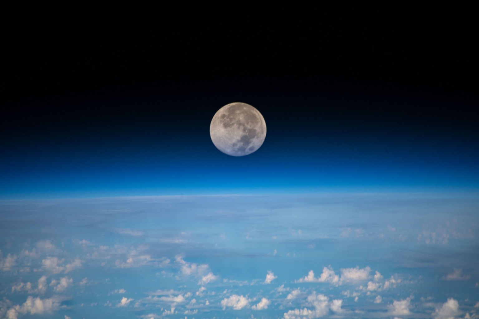 The full moon is pictured as the International Space Station orbited 254 miles above the Pacific Ocean northeast of Guam.
