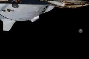 iss068e039227 (Jan. 6, 2023) --- The Full Moon is pictured from the International Space Station along with a portion the SpaceX Dragon Endurance crew ship while orbiting 264 miles above southern Brazil.