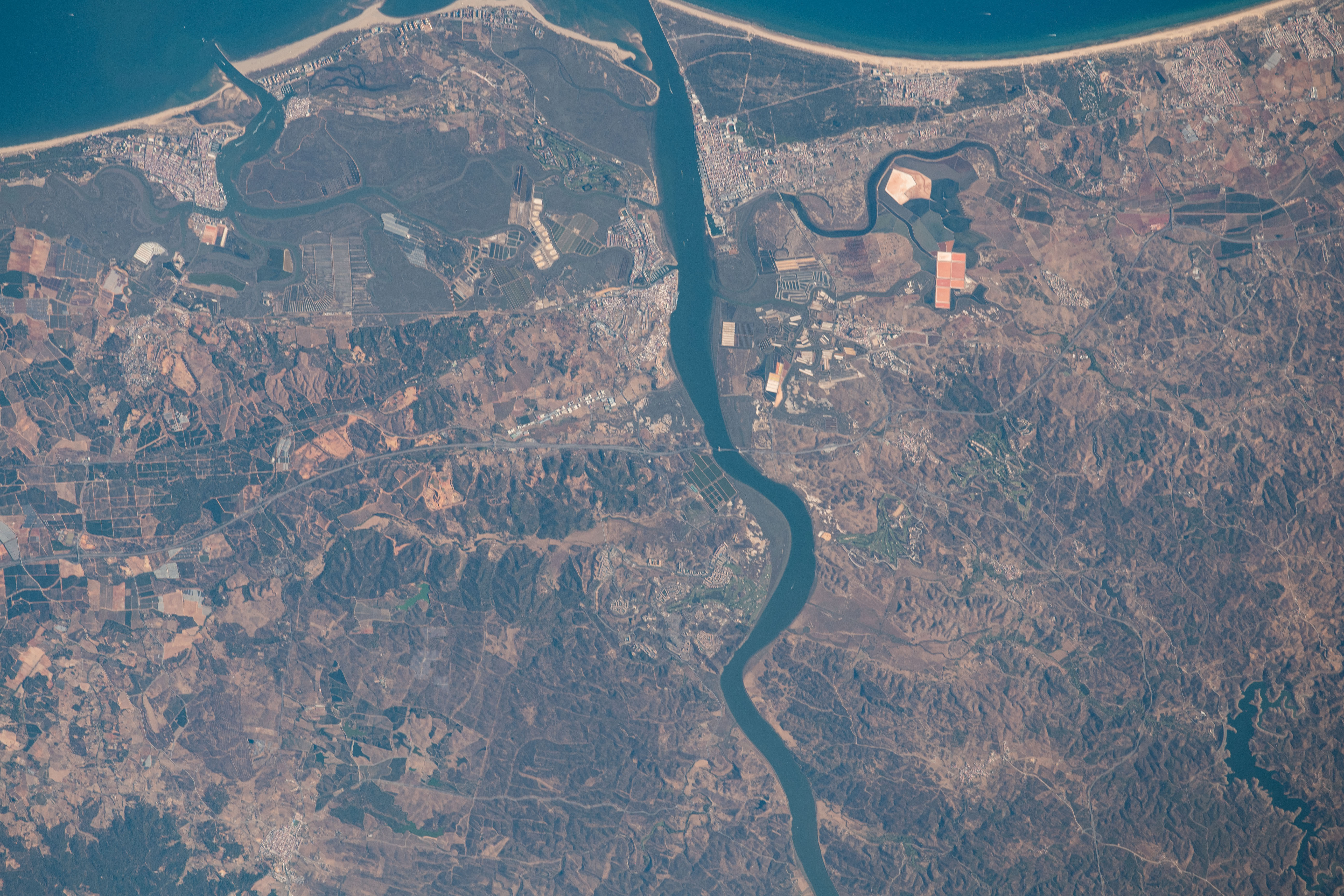 iss063e070330 (Aug. 13, 2020) --- The Guadiana River flows into the Gulf of Cádiz in the Atlantic Ocean and is the border for the southern coastal portions of Portugal (right) and Spain (left).