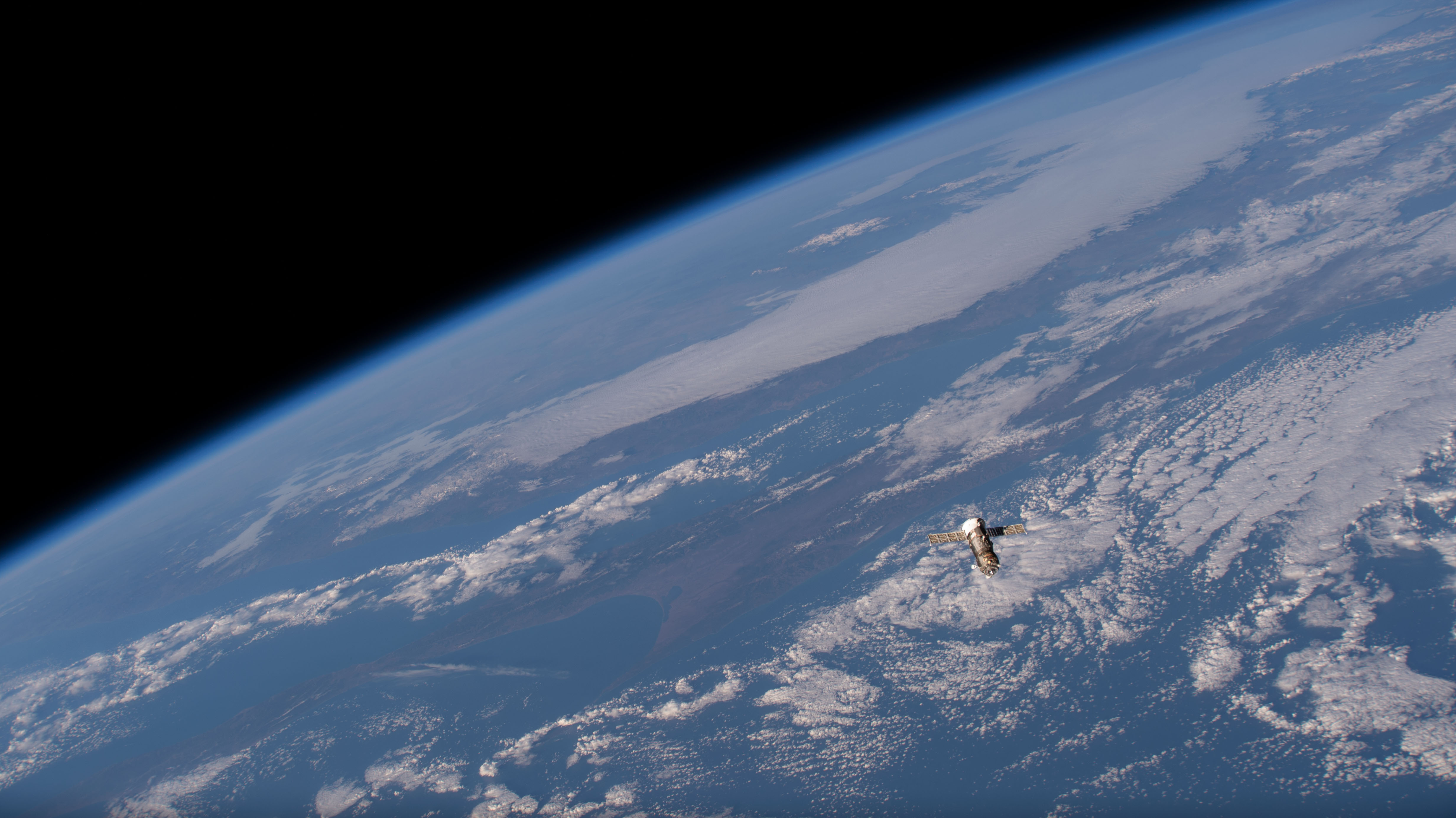 iss068e018242 (Oct. 23, 2022) --- The uncrewed ISS Progress 80 cargo craft is pictured departing the vicinity of the International Space Station after undocking from the orbiting lab's Poisk module. The trash-filled Progress 80 would reenter the Earth's atmosphere above the Pacific Ocean a few hours later for a fiery, but safe demise.