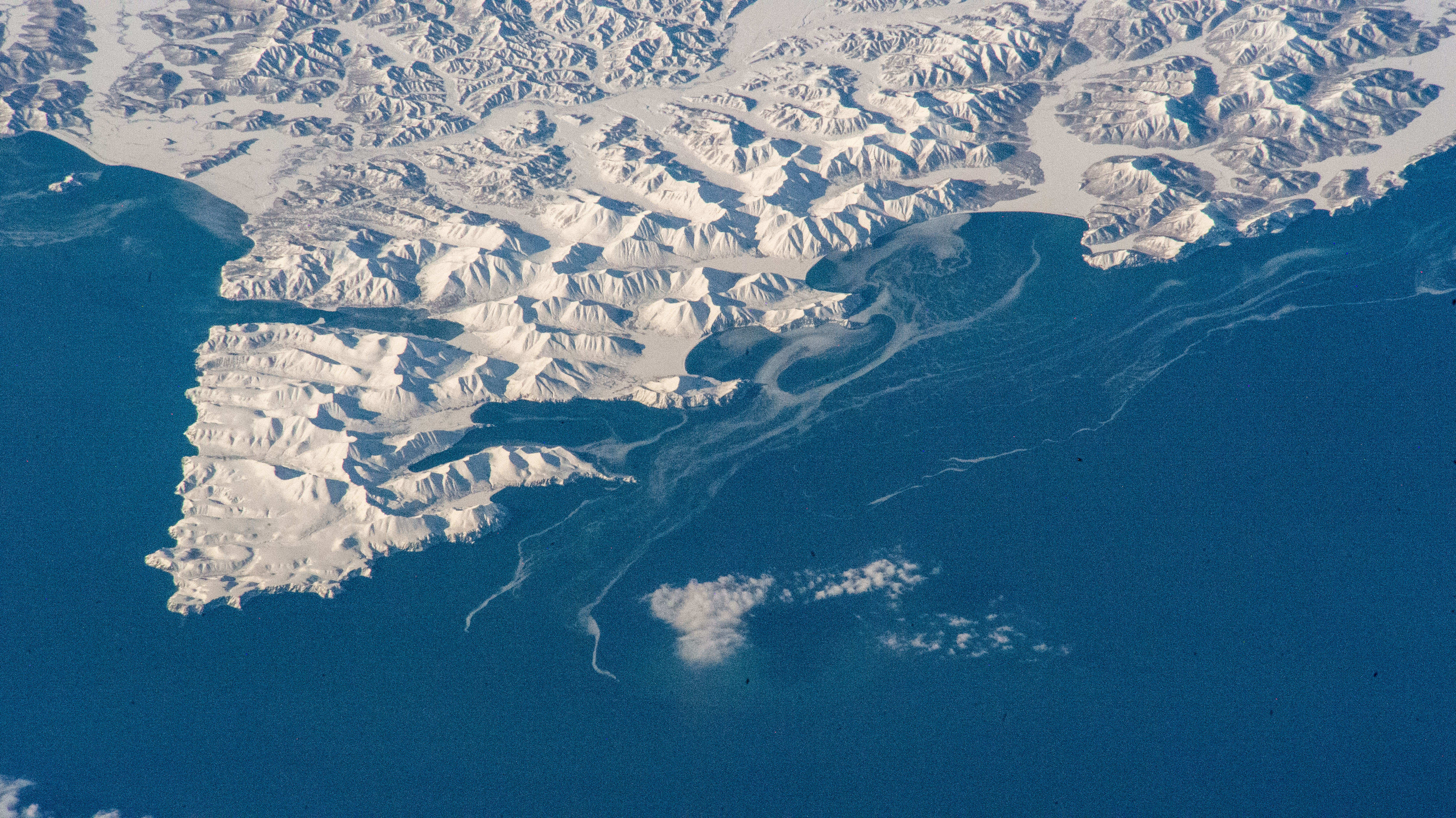 iss068e051131 (Feb. 10, 2023) --- The snow-covered, mountainous southeast coast of Russia's Kamchatka Peninsula is pictured from the International Space Station as it orbited 265 miles above the Pacific Ocean.
